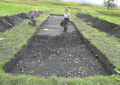 Big dig 2021 Trench 12 - Gordon and Mary-Ann revealing the cobbled surface. 24.09.2021