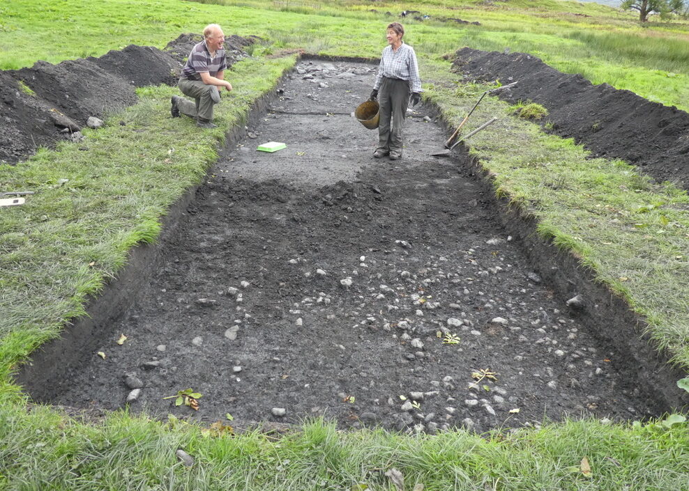 Big dig 2021 Trench 12 - Gordon and Mary-Ann revealing the cobbled surface. 24.09.2021