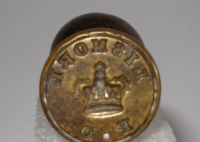 LISDD:2008.132 Post office stamp from Achnacroish. Handle length 8.9cm, stamp diameter 2.2cm