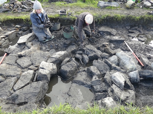 Hylda Marsh (newly arrived from Mull) and Clare revealing the complex internal arrangements, still to be interpreted. It is looking as if there are at least two phases of building, possibly the result of fire damage.