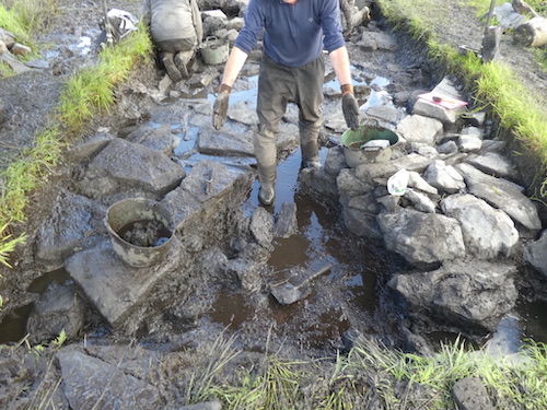 Andy demonstrating the widening of the entrance towards the outside