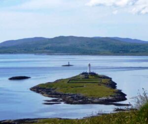 Lismore LIghthouse on Eilean Musdile with the Lady Rock beacon and Mull to the West